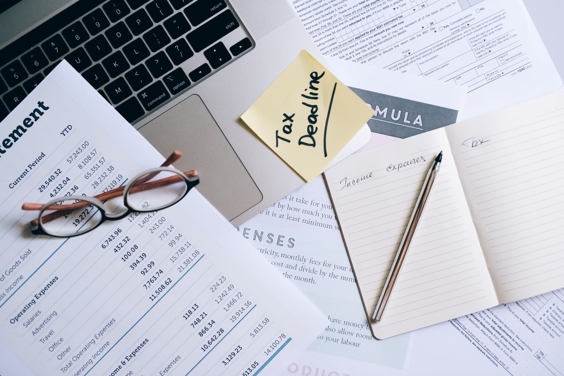 Corporate tax documents and financial records on a desk