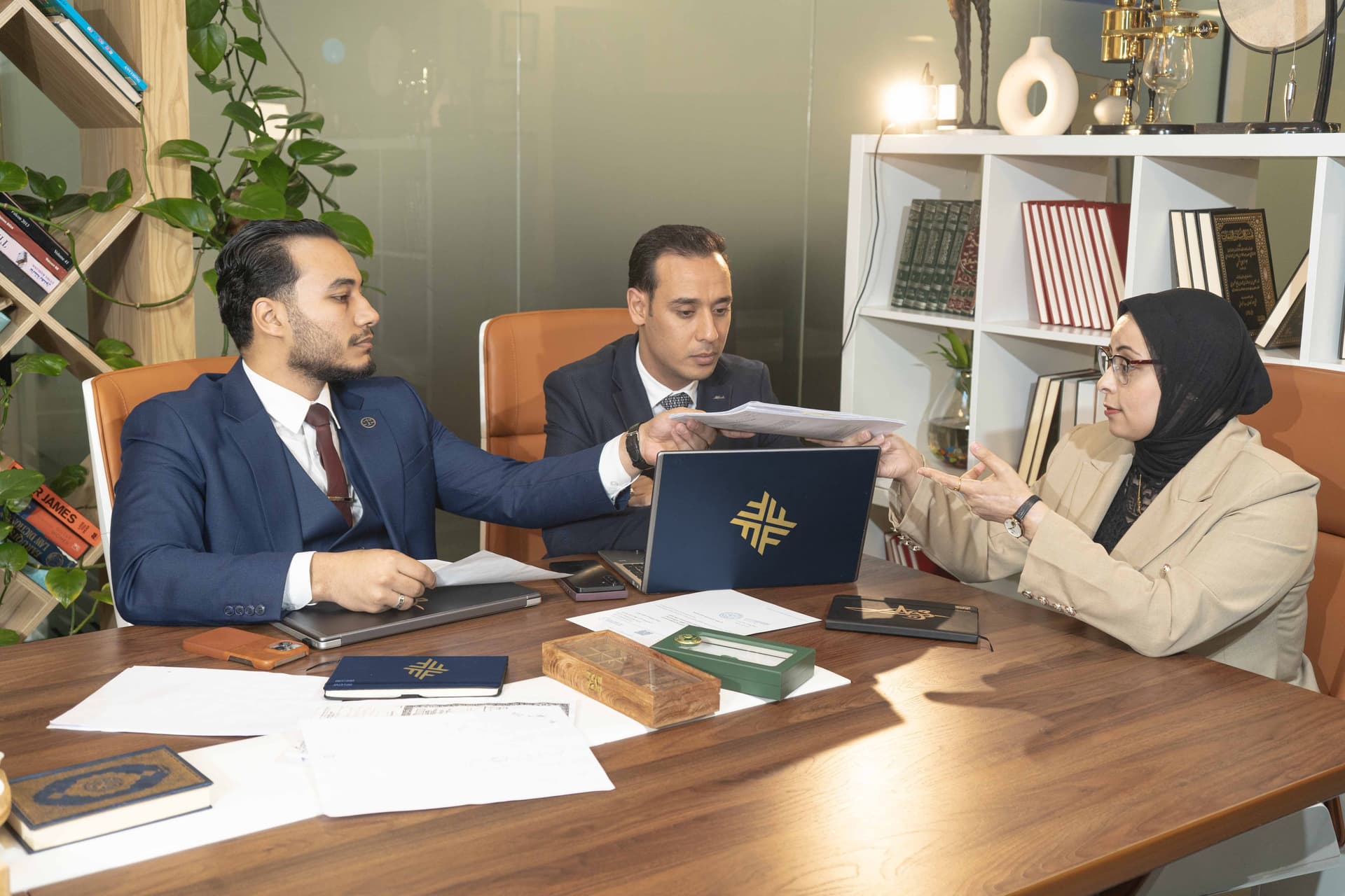 Al FATEH advisors reviewing documents together
