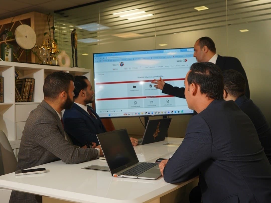 The finance team reviewing accounts on screen